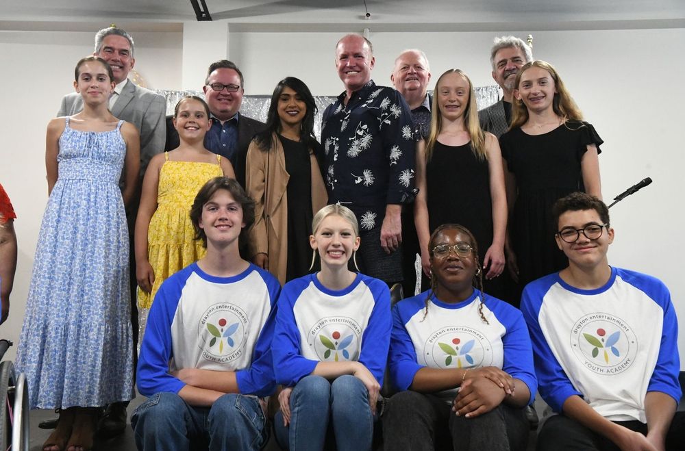 Kitchener-Conestoga MP Tim Louis, Cambridge MP Bryan May, Waterloo MP Bardish Chagger, Drayton Entertainment’s David Connolly, Neil Aitchison and Alex Mustakas with some of the young performers involved with the Youth Academy. [Leah Gerber]